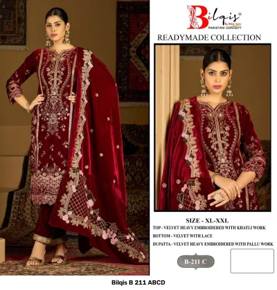 Bilqis B 211 C: Maroon velvet Pakistani suit with heavy embroidery, khatli work, lace-trimmed trousers, and an embroidered velvet dupatta.
