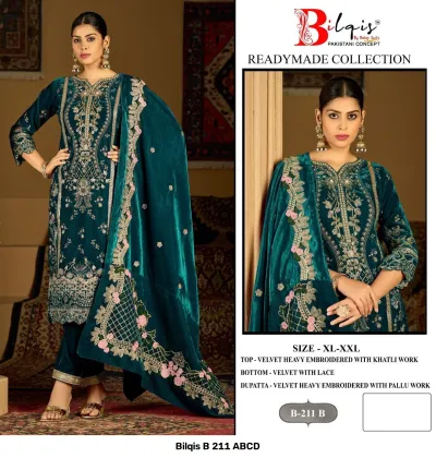 Bilqis B 211 B: Teal velvet Pakistani suit with heavy embroidery, khatli work, lace-trimmed trousers, and an embroidered velvet dupatta.