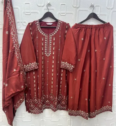 Bilqis B 271 ABCD: A rust-colored salwar suit with a kurta and wide-leg palazzo, featuring silver thread work embroidery and embellishments on the borders.