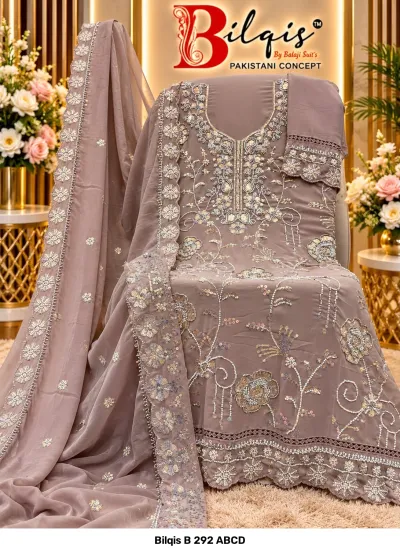 Bilqis B 292 ABCD: Muted mauve salwar suit featuring heavy floral beadwork embroidery and matching dupatta with scalloped borders.