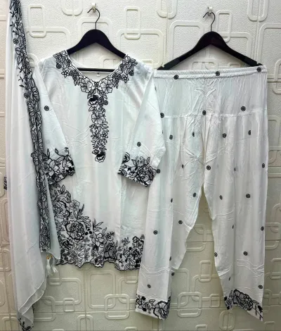 Elan Studio E 58: White rayon salwar suit set featuring black floral thread work embroidery on the kurti, salwar, and matching dupatta.