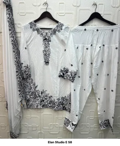 Elan Studio E 58: White rayon salwar suit set featuring black floral thread work embroidery on the kurti, salwar, and matching dupatta.