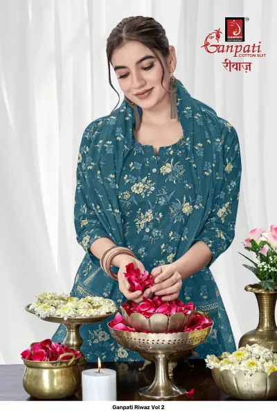 Ganpati Riwaz Vol 2 close-up of a dark teal salwar suit with yellow floral print and matching dupatta.