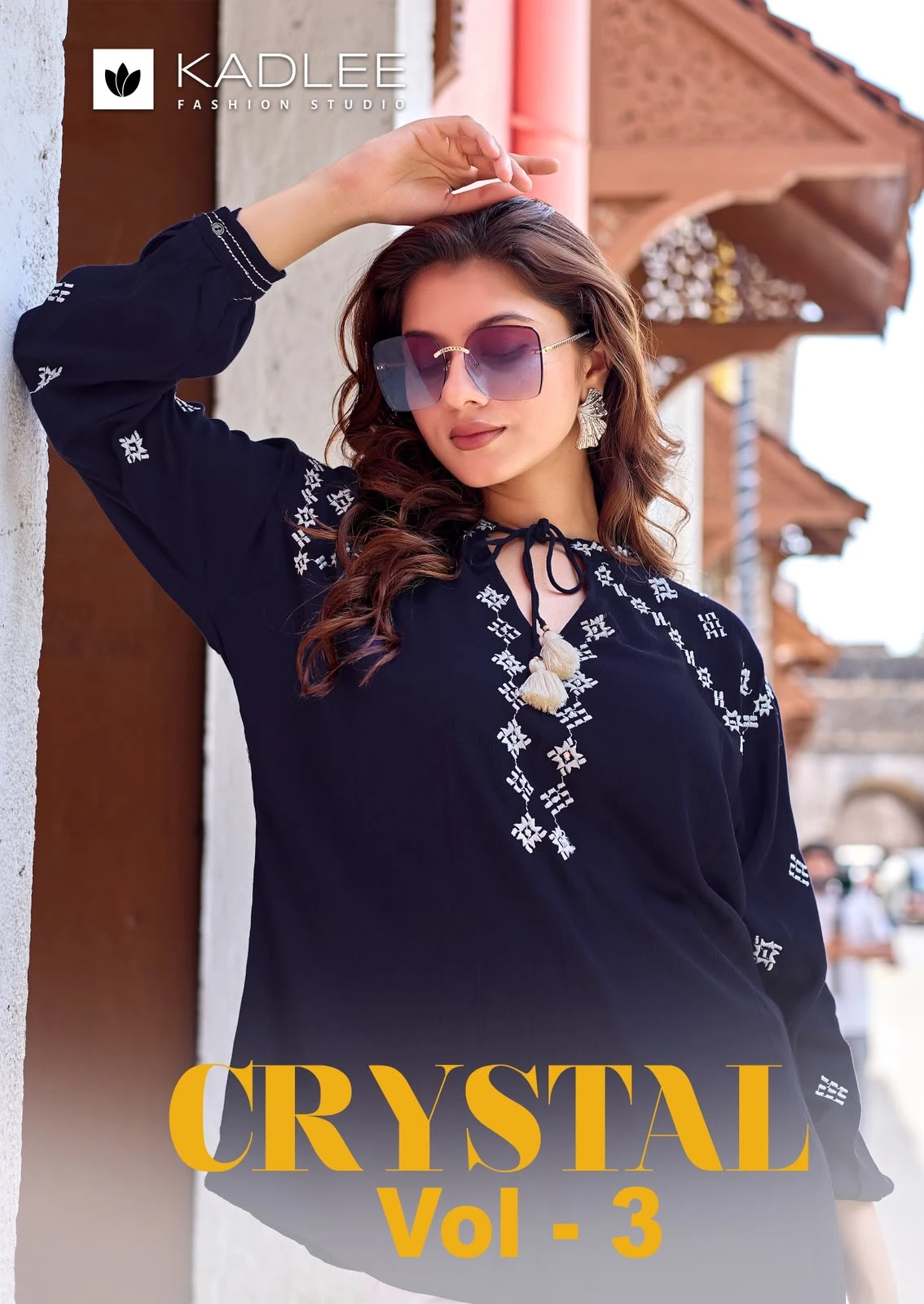 Kadlee Crystal Vol 3, dark blue kurti featuring white thread work embroidery and tassel neck detailing.