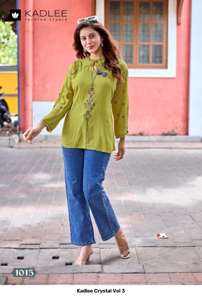Kadlee Crystal Vol 3, olive green kurti with vertical thread work embroidery and tassel neck detailing paired with blue jeans.