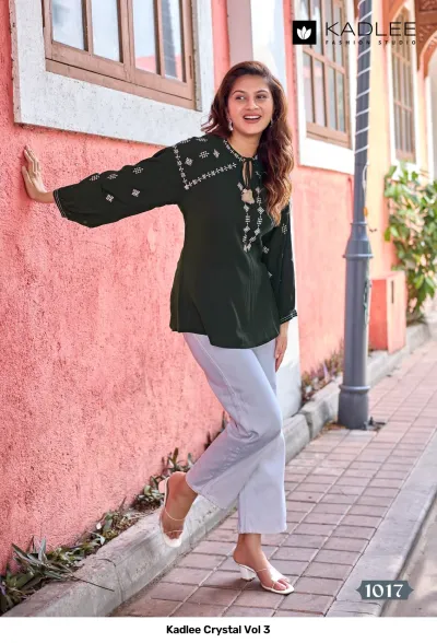 Kadlee Crystal Vol 3, dark green kurti with white thread work embroidery and tassel neck detailing.