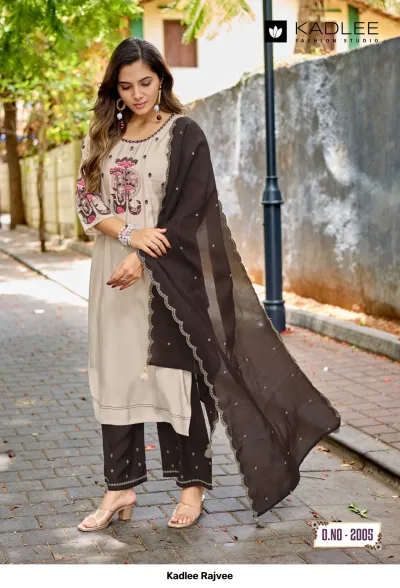 Kadlee Rajvee D.No-2005: Woman wearing a beige kurti with dark brown palazzo pants and a dark brown dupatta with scalloped edges.