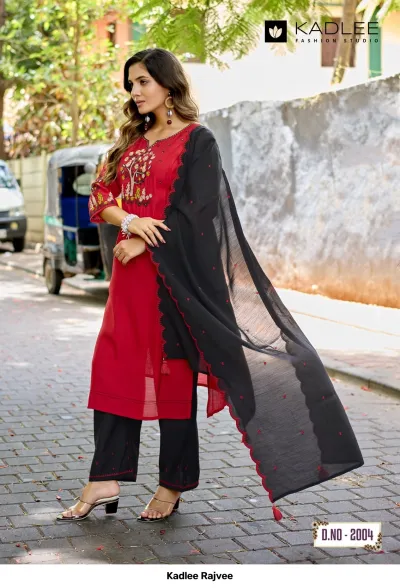 Kadlee Rajvee D.No-2004: Woman wearing a red kurti with black palazzo pants and a black dupatta featuring scalloped edges.