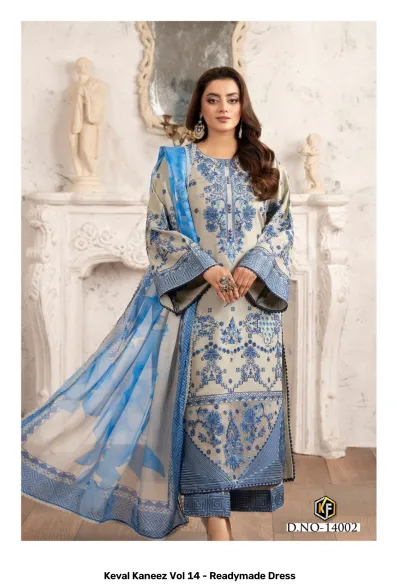 Keval Kaneez Vol 14 - Readymade Dress. Model wearing a beige kurti with blue floral embroidery and print, paired with a matching printed dupatta.