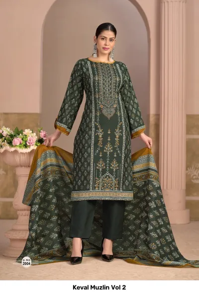 Keval Muzlin Vol 2: Dark green salwar suit with detailed print patterns, thread work embroidery, plain pants, and a contrasting mustard-bordered printed dupatta.