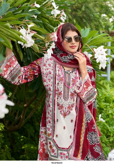 Keval Naznin, burgundy and white printed cotton salwar suit with intricate thread work embroidery and matching dupatta.