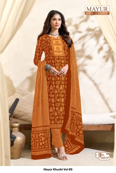 Mayur Khushi Vol 85 orange salwar suit with traditional block print motifs, an embroidered neckline, striped pants, and a matching dupatta.