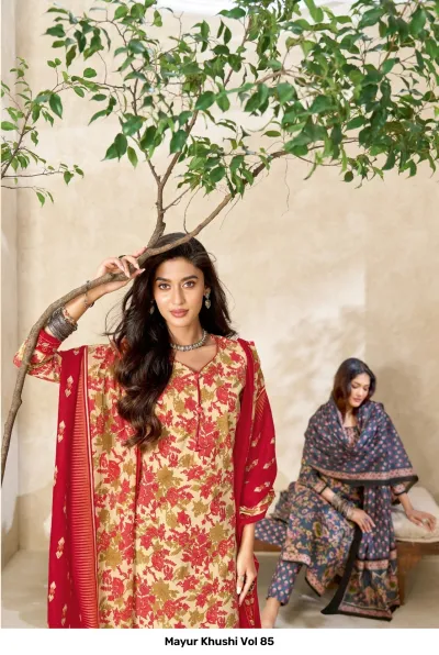 Mayur Khushi Vol 85 beige kurti with red floral prints and a red dupatta, shown alongside a model in a dark floral suit.