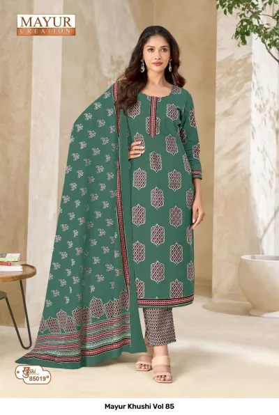 Mayur Khushi Vol 85 emerald green salwar suit with geometric patterns, an embroidered neckline, matching printed pants, and a patterned dupatta.