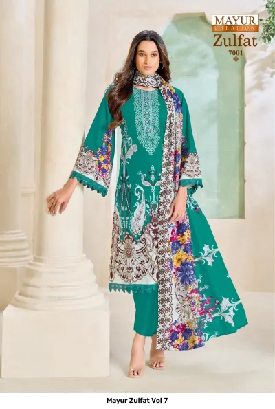 Mayur Zulfat Vol 7 teal salwar suit featuring floral print, solid trousers, and intricate white thread work on the neckline.