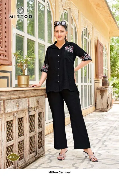 Mittoo Carnival 4002 black co-ord set with a button-down shirt and straight trousers, featuring floral thread embroidery on the pocket and sleeves.