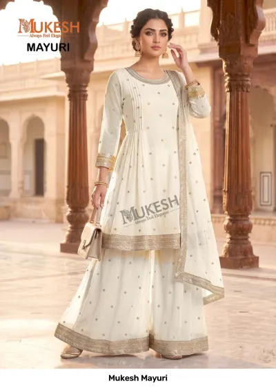 Mukesh Mayuri: A cream-colored sharara salwar suit with gold zari work and matching dupatta, suitable for festive occasions.