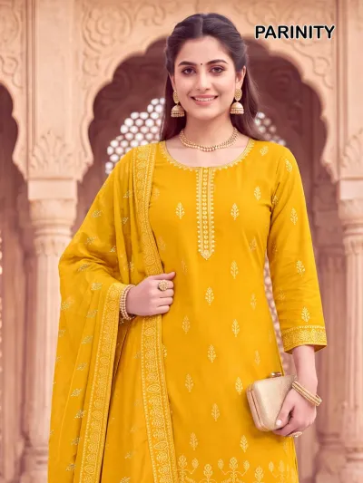 Mukesh Pariniti mustard yellow kurta set with a matching dupatta, gold print patterns, and gold zari work on the neckline.
