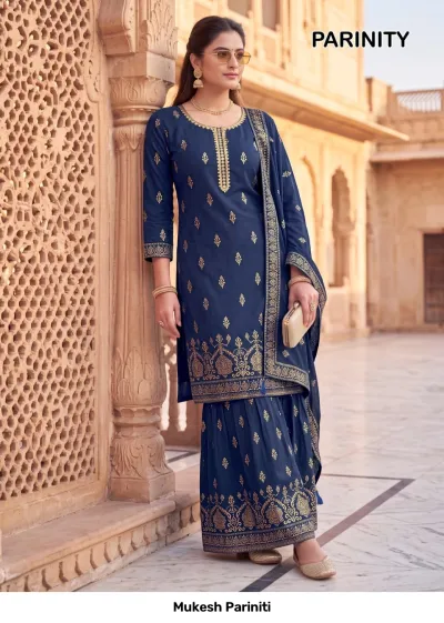 Mukesh Pariniti dark blue salwar suit with a printed kurta and sharara, featuring gold zari neck embroidery and matching dupatta.