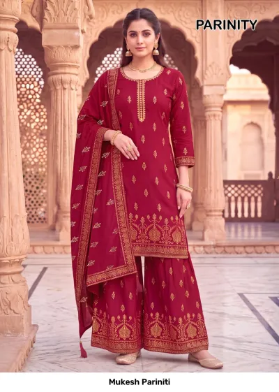 Mukesh Pariniti deep maroon salwar suit with a kurta and sharara, featuring gold block print patterns and detailed zari work.