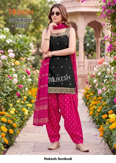 Mukesh Sonikudi 1002, black sleeveless kurti with gold thread work and patterned pink salwar with matching dupatta.