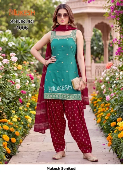 Mukesh Sonikudi 1006, teal kurti with gold embroidery, paired with a maroon printed salwar and matching dupatta.