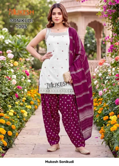 Mukesh Sonikudi 1005, white sleeveless kurti with gold embroidery, paired with a purple printed salwar and matching dupatta.