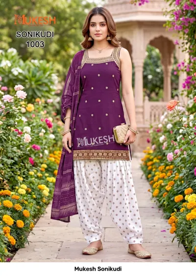 Mukesh Sonikudi 1003, purple kurti with gold thread embroidery, paired with a white printed salwar and matching dupatta.