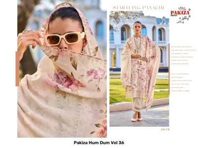 Pakiza Hum Dum Vol 36: A woman holding a floral printed dupatta, wearing a beige salwar suit with floral prints.