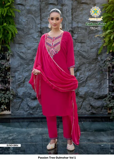 Passion Tree Gulmohar Vol 1: Hot pink salwar suit with dense floral thread work on the neckline, matching pants, and a plain dupatta.