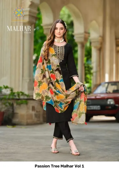Passion Tree Malhar Vol 1: Black salwar suit with embroidered neckline, paired with a vibrant floral and abstract print dupatta.
