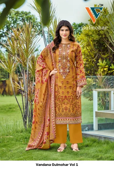 Vandana Gulmohar Vol 1 mustard yellow printed salwar suit with intricate white thread embroidery and floral motifs, paired with a matching patterned dupatta.
