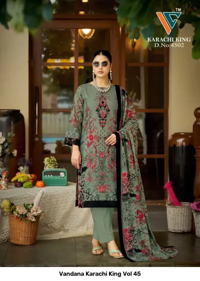 Vandana Karachi King Vol 45: olive green cotton salwar suit with floral prints and a matching dupatta featuring black border details.