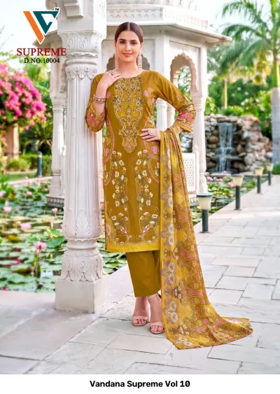 Vandana Supreme Vol 10: Mustard yellow cotton salwar suit with pink and white floral prints, matching trousers, and a coordinating printed dupatta.