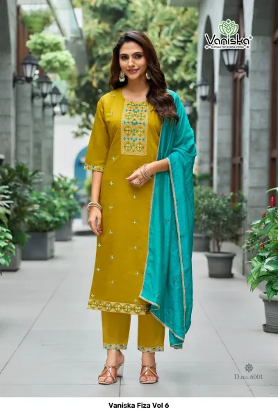 Vaniska Fiza Vol 6 mustard yellow straight cut salwar suit with teal dupatta, featuring geometric thread embroidery on the neckline and pants.