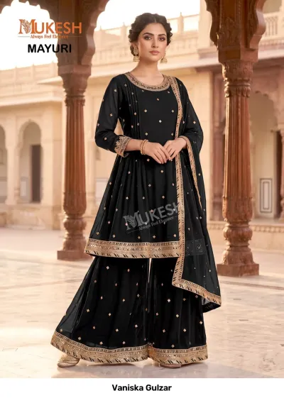 Vaniska Gulzar: Black sharara salwar suit featuring gold sequin detailing and intricate zari work borders.