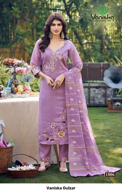 Vaniska Gulzar: Full-length view of a lilac salwar suit with floral embroidery, featuring a straight-cut kurti, trousers, and zari-detailed dupatta.