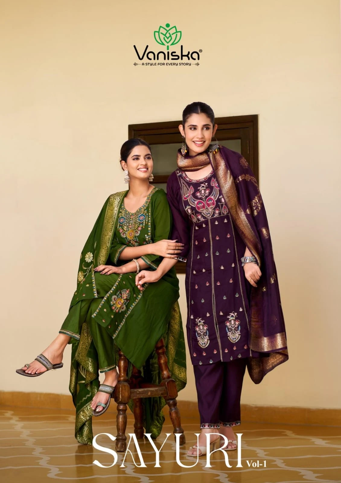 Vaniska Sayuri Vol 1 catalog cover featuring models in green and purple salwar suits with embroidery and zari work dupattas.