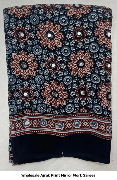 Wholesale Ajrak Print Mirror Work Sarees: A dark-colored printed saree with circular floral motifs and mirror work.