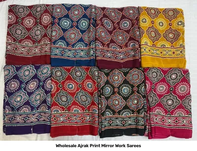Wholesale Ajrak Print Mirror Work Sarees: Multicolored printed sarees with repeating floral and geometric patterns, plus mirror work.