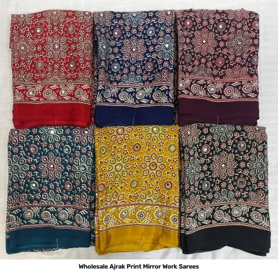 Wholesale Ajrak Print Mirror Work Sarees: Multicolored printed sarees with small leaf-style patterns and mirror work borders.