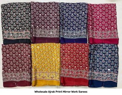 Wholesale Ajrak Print Mirror Work Sarees: Multicolored printed sarees with repeating star-like motifs and mirror work.