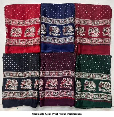 Wholesale Ajrak Print Mirror Work Sarees: Multicolored printed sarees with small floral patterns and mirror work borders.