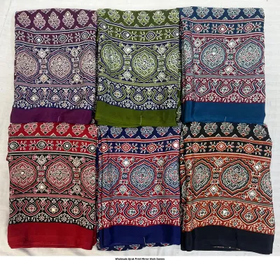Wholesale Ajrak Print Mirror Work Sarees: Multicolored printed sarees with large circular paisley motifs and mirror work.