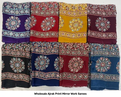 Wholesale Ajrak Print Mirror Work Sarees: Multicolored printed sarees with circular floral patterns and mirror work detailing.