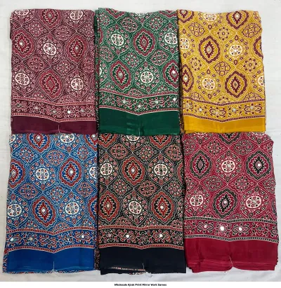 Wholesale Ajrak Print Mirror Work Sarees: Multicolored sarees with repeating geometric floral patterns and mirror work accents.