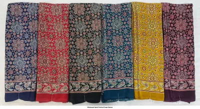 Wholesale Ajrak Printed Crepe Sarees: Six colorful sarees featuring large floral Ajrak block print patterns.