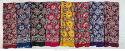 Wholesale Ajrak Printed Crepe Sarees: Six folded sarees in vibrant colors with repetitive floral Ajrak block prints.