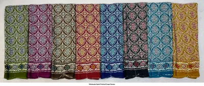 Wholesale Ajrak Printed Crepe Sarees: Six colorful sarees with repeating geometric block print patterns.