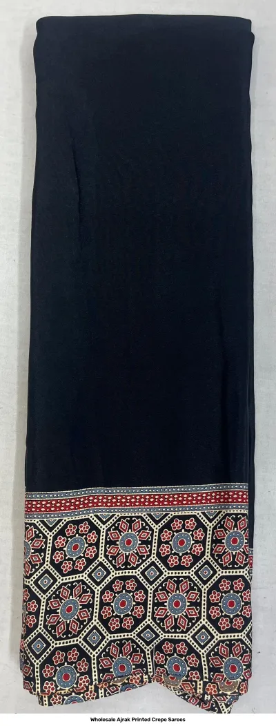 Wholesale Ajrak Printed Crepe Sarees: Seven colorful folded sarees with decorative border and central Ajrak patterns.